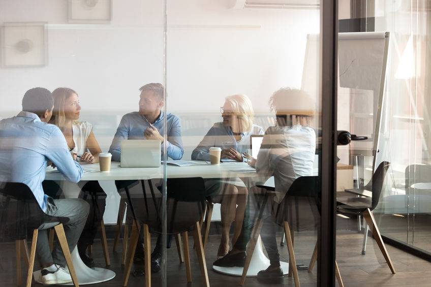 Team around board room table